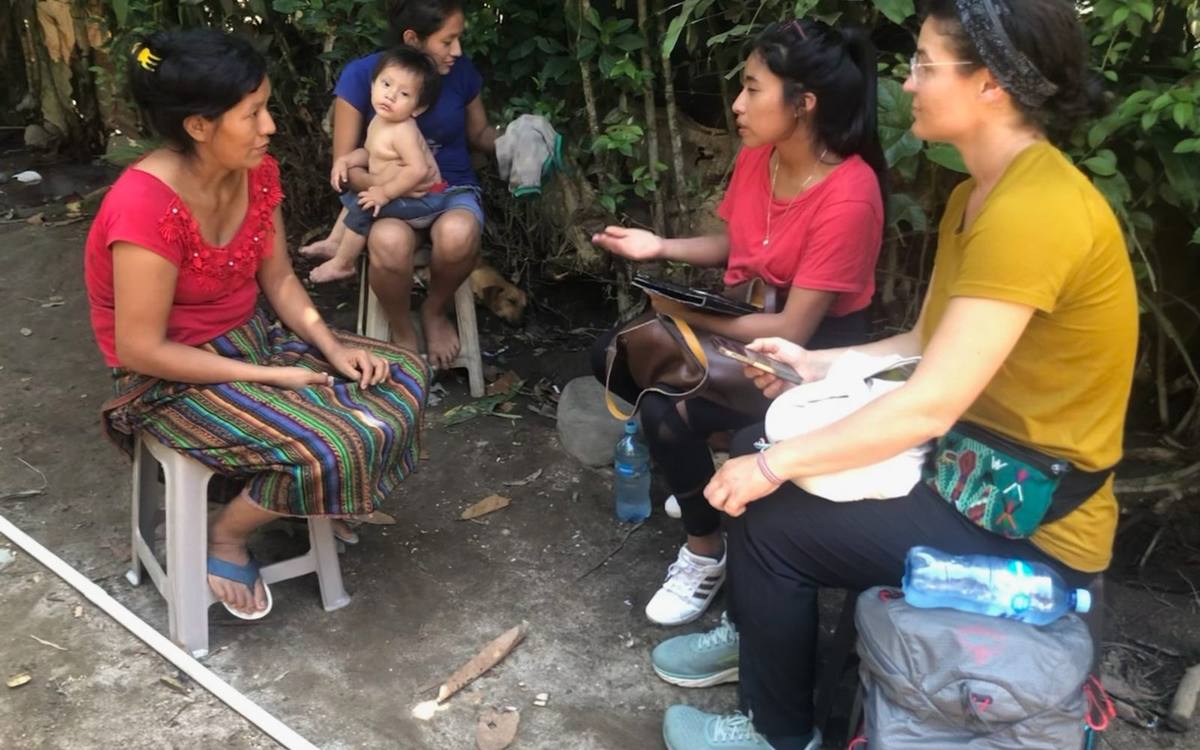 Local health workers interview a mother during a home visit, Chicacao, Guatemala.