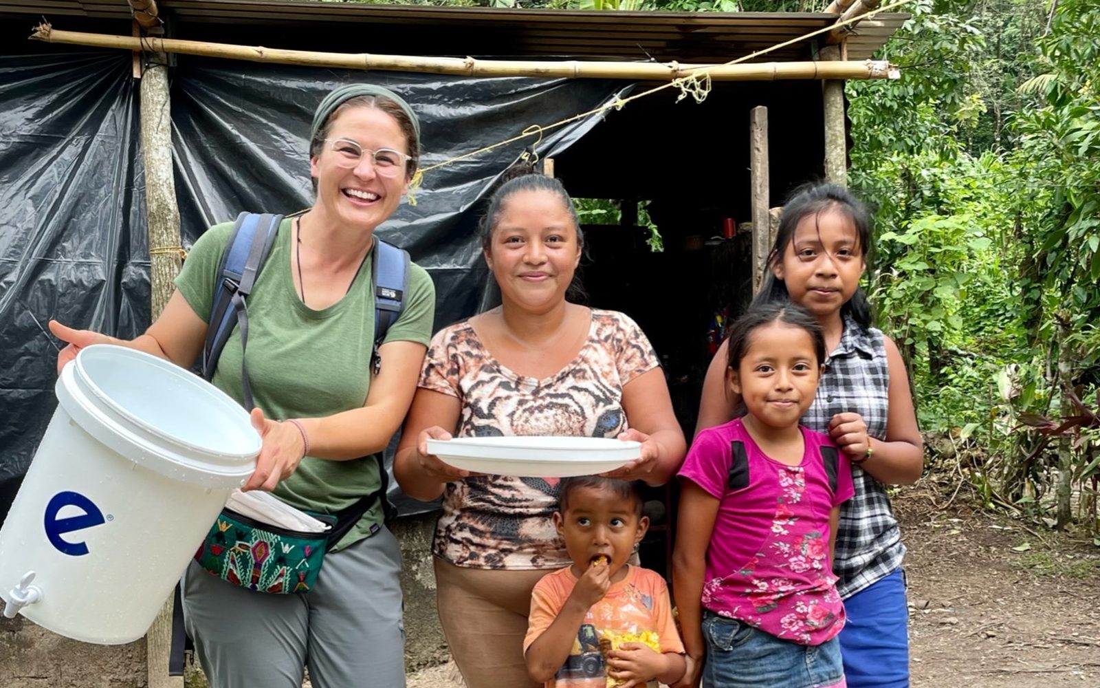Family receives a ceramic Ecofiltro water filter and bucket for clean drinking water, Chicacao, Guatemala.