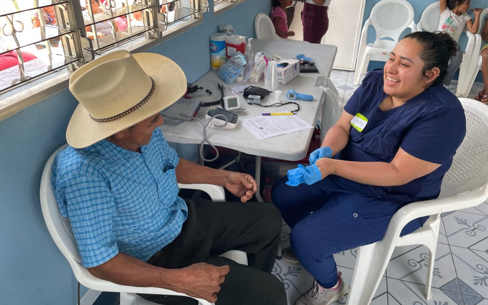 Nurse speaking with an elder during a mobile clinic in Chicacao, Guatemala.